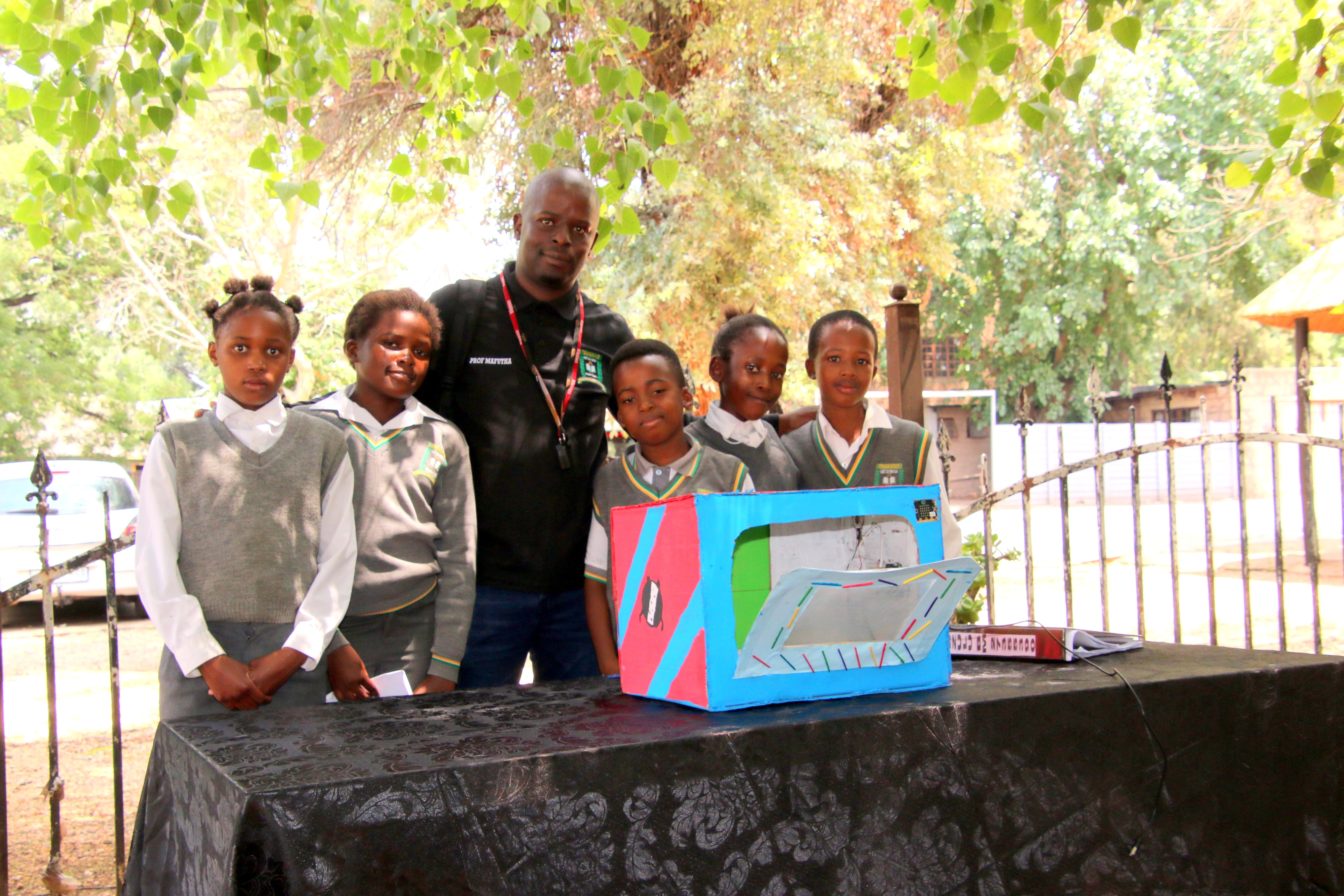 Pupils From Mega Primary School And Educator Bheki Mngomezulu With Their Food Warmer Project.